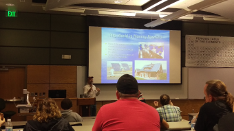 Solar expert, Bob Nagy, lecturing with a student body on the how the world is moving forward with solar energy.