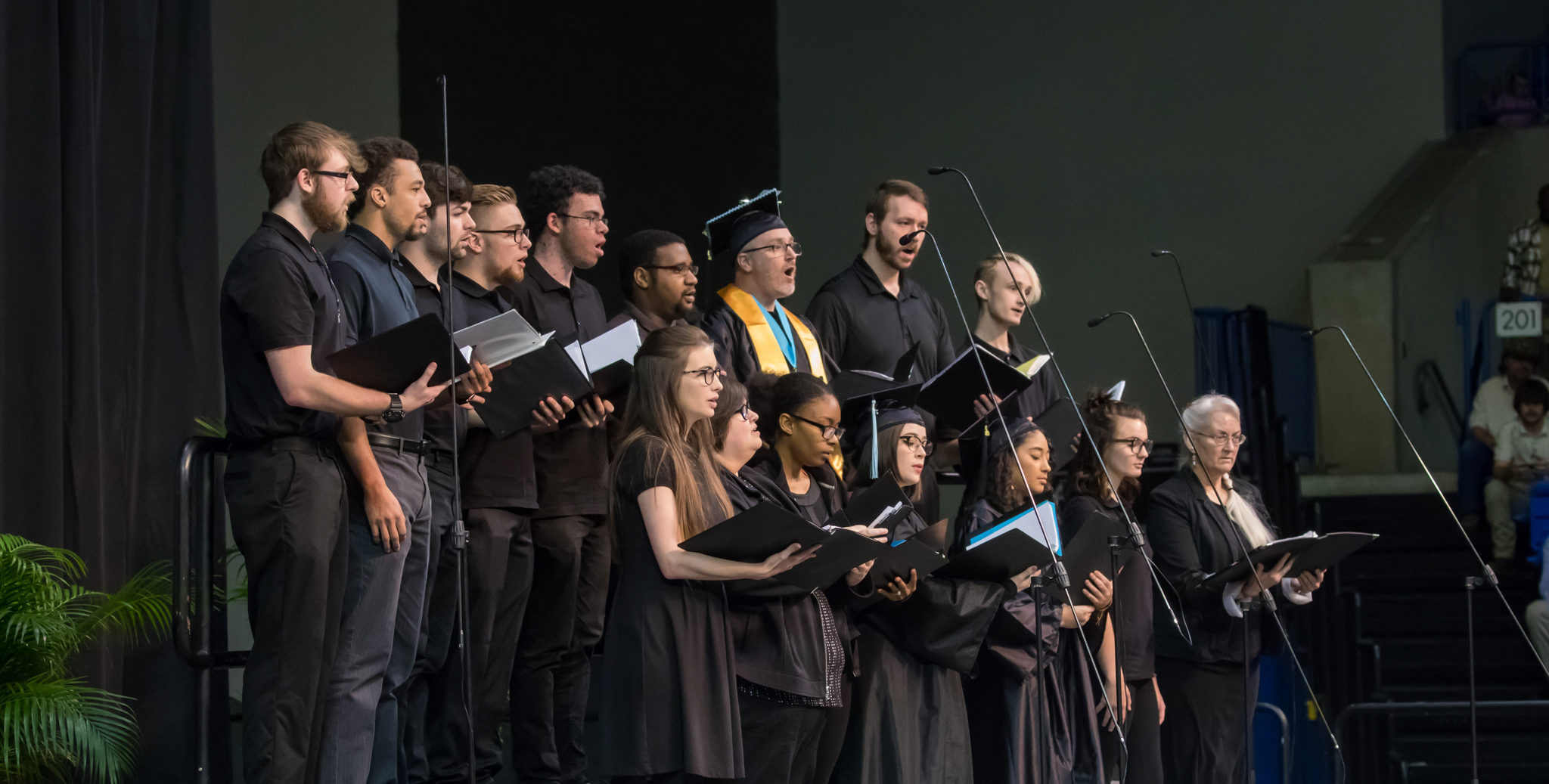 Choir performing in auditorium