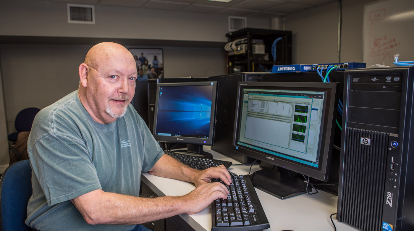 man working at computer