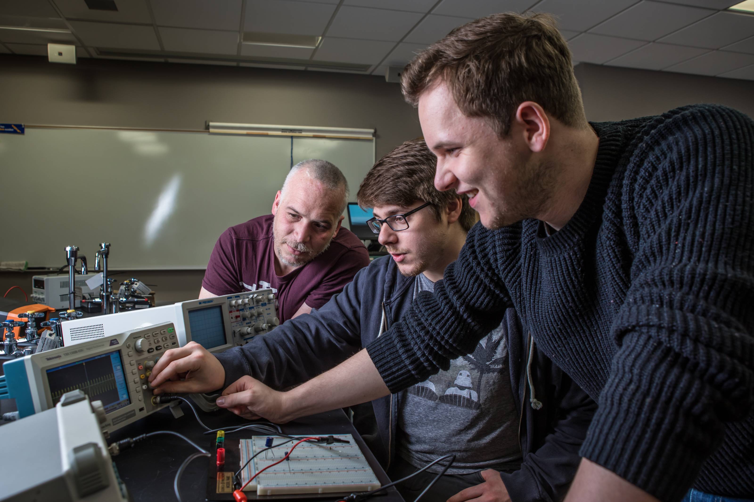 Engineering students working with equipment