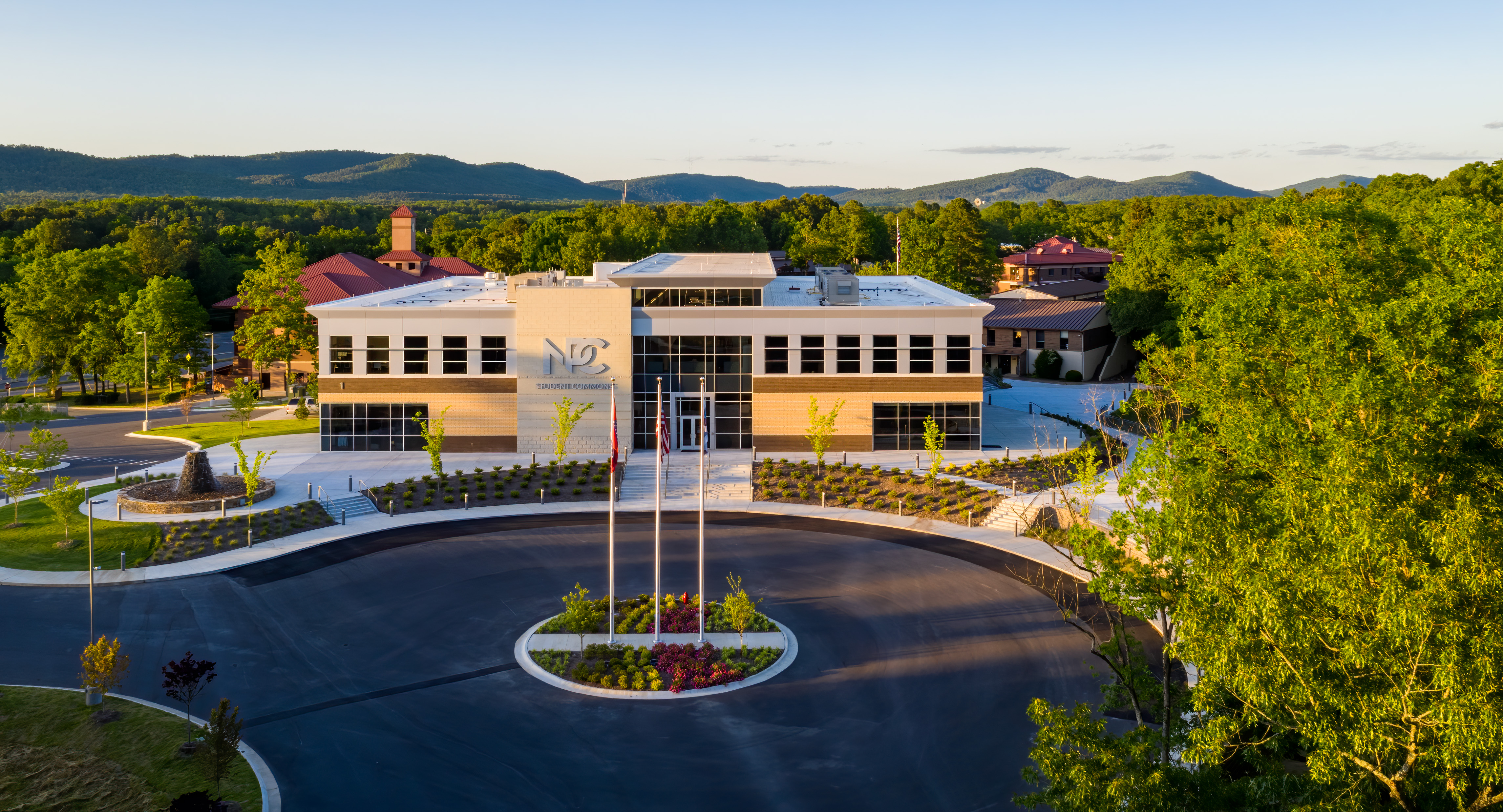 National Park College Student Commons building with a mountain view in the distance.