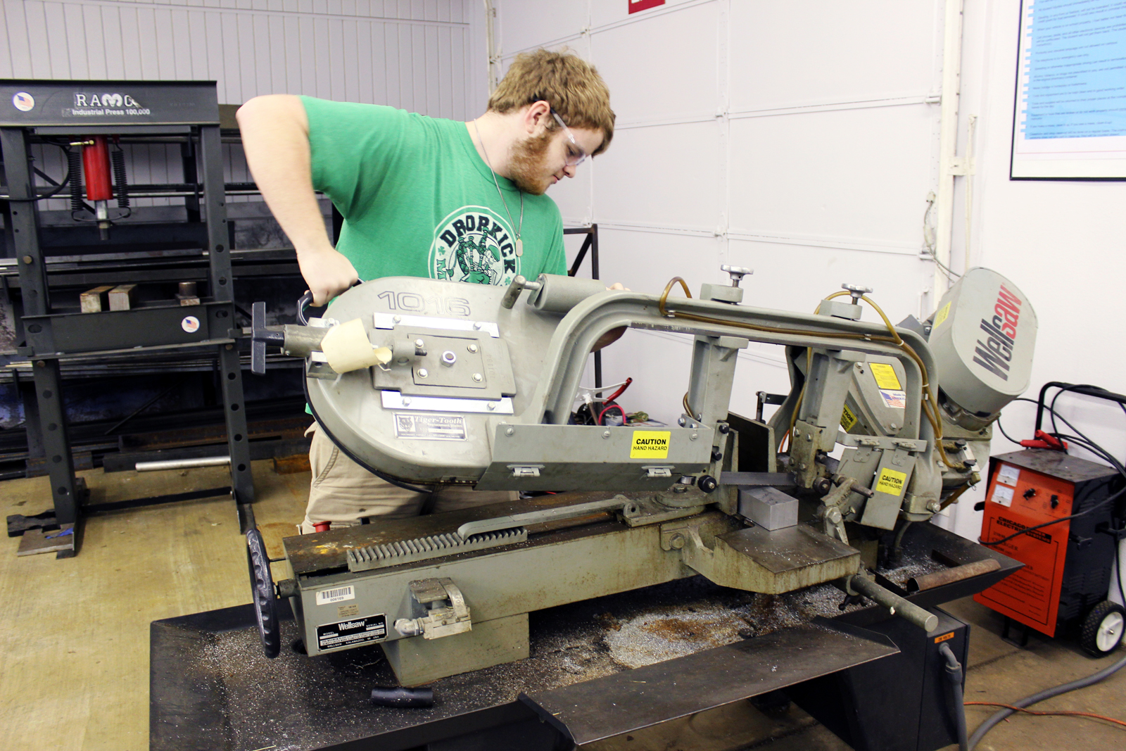 Student working on large machine in workshop