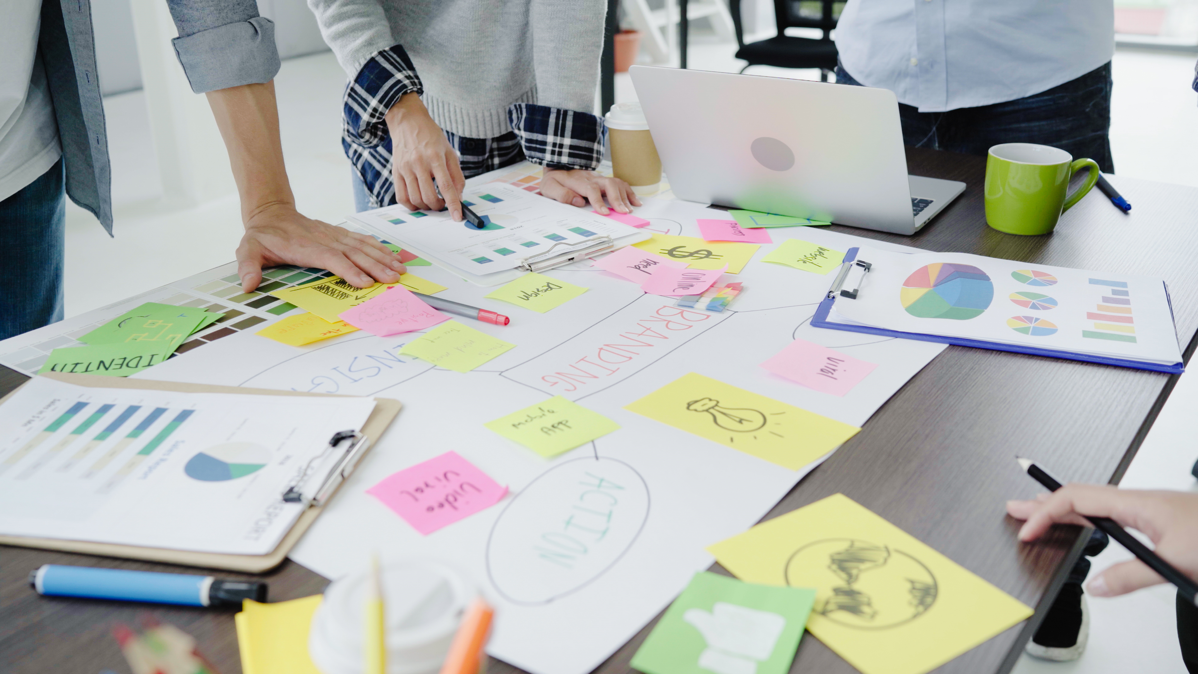 Marketing table with sticky notes and graphs