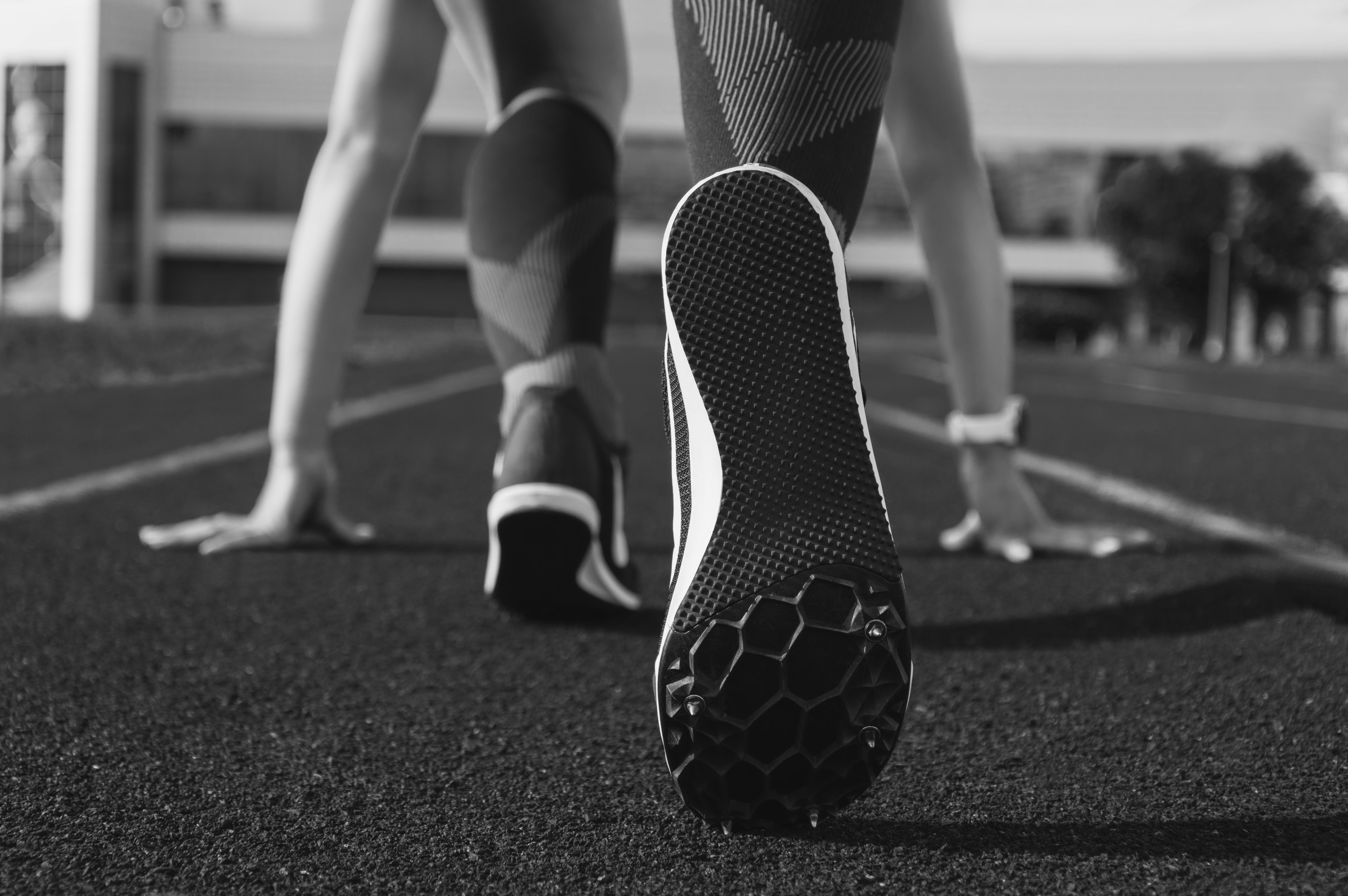 Runner in starting position on track