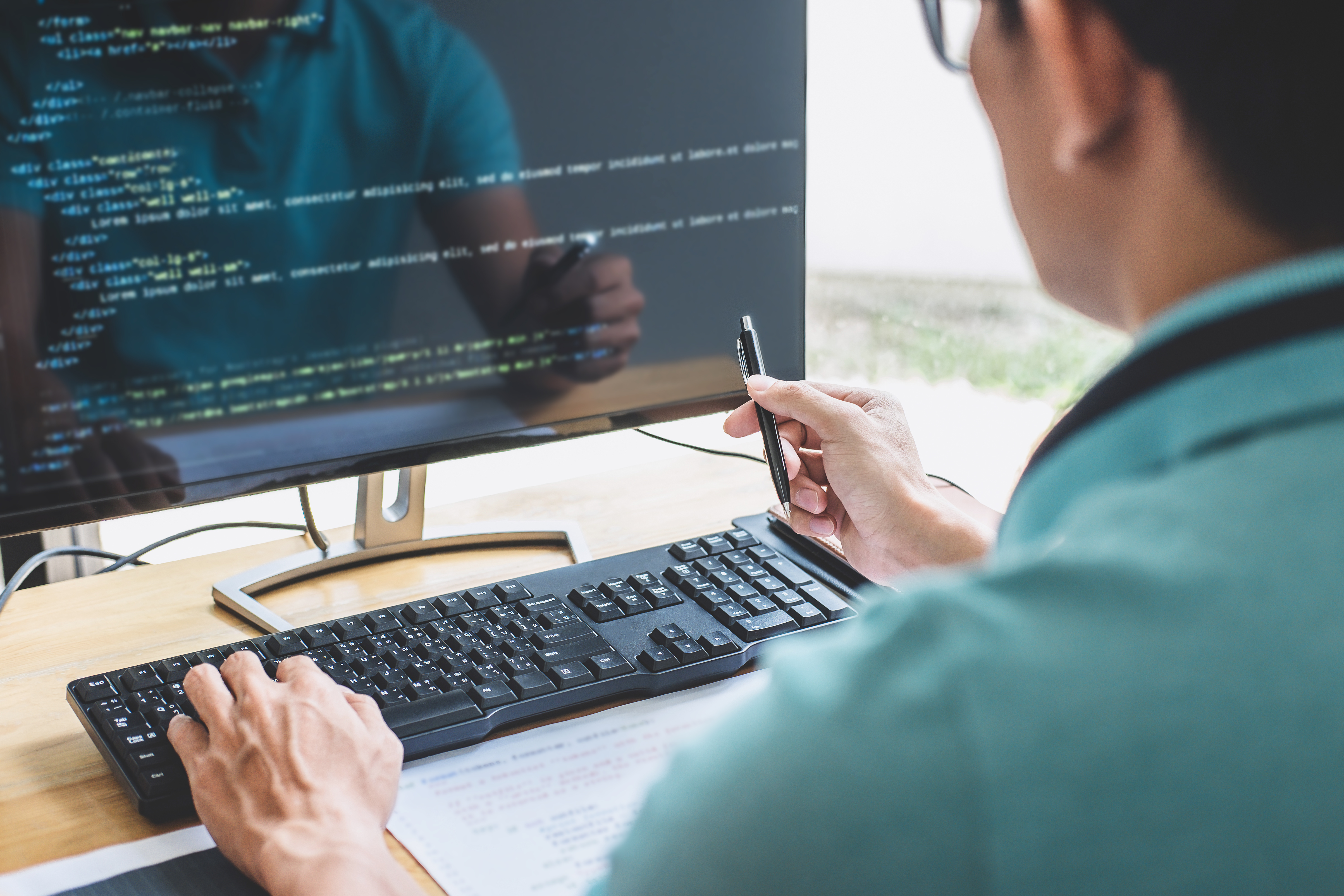 Man coding on computer