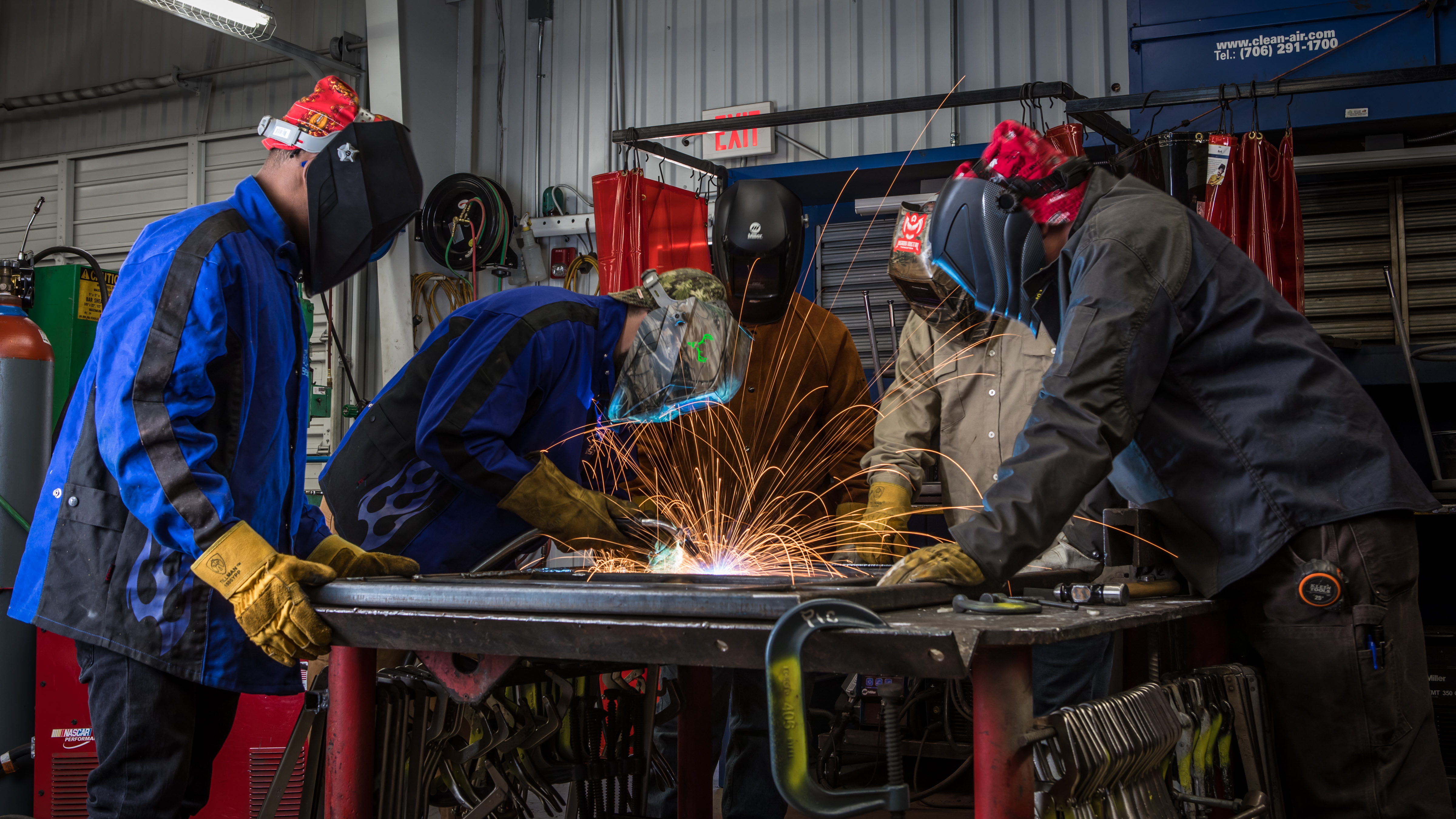 Group of students welding