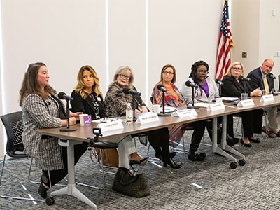 Group of adults sitting at a table talking