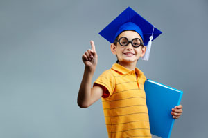 Child wearing graduation cap