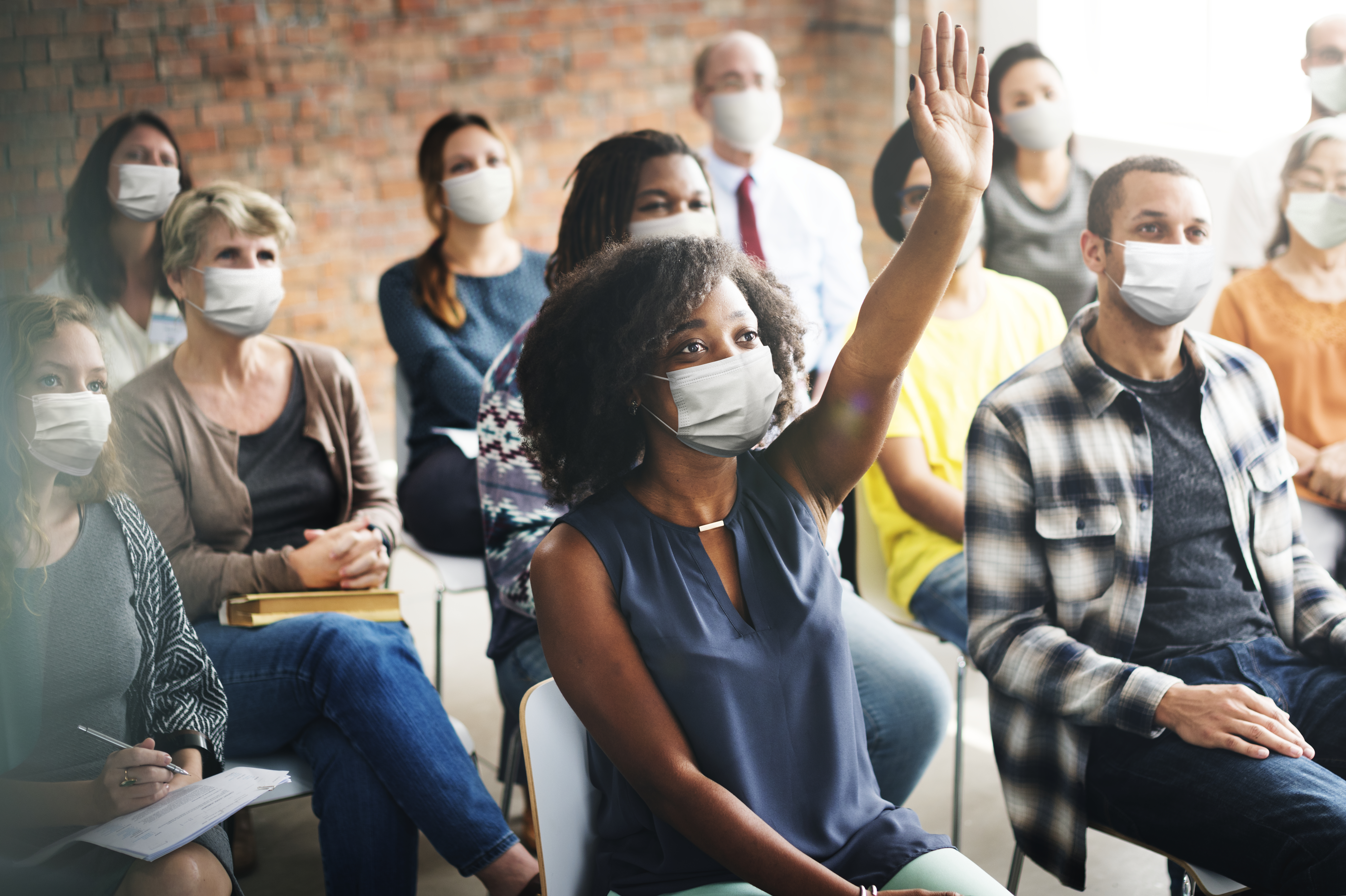 people wearing masks during a workshop
