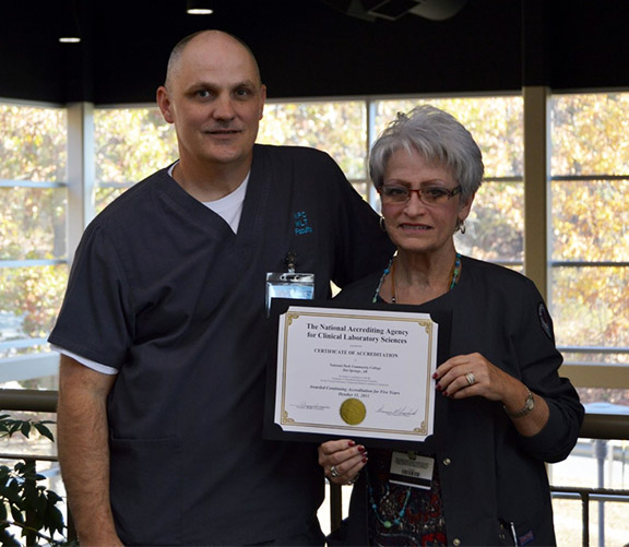 : MLT Instructor Britt Turner and MLT Program Director, Carol Spargo with their ten-year continuing accreditation.