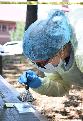 Students study crime scenes for clues