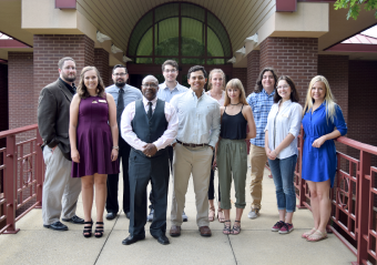 Student Government Association standing in front of the clock tower for a photo