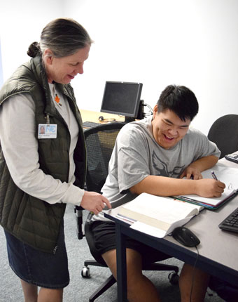 Bee Thao receiving tutoring from Paula Henderson, a tutor for NPC.