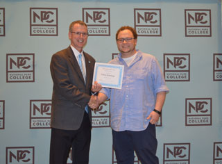 Dillion Jennings, a student at NPC, receiving an award for his respiratory therapy poster, bedside tracheostomy.