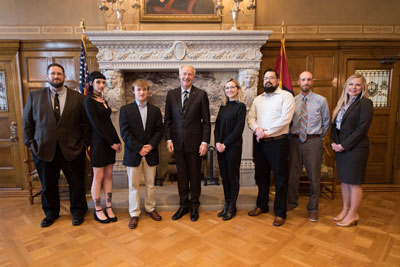 NPC students in a group photo with Governor Asa Hutchinson