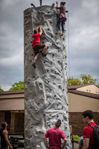 Students enjoy a rock wall during Spring Fling 2018 at National Park College