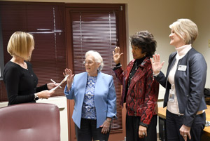 County Clerk, Sarah Smith swearing in board members Gail Ezelle, Joyce Craft and Beverly Joe.