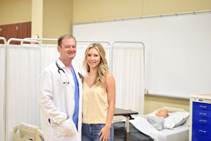 Cody and Aubrie Hobby standing in a medical room simulation at National Park College.