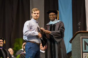 Harris Felton receiving award from Dr. Thomas.
