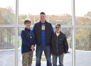 Josh Mills (center) and Steven Eberly (right) with June Luciew