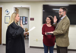 Dr. Wade Derden being sworn in by Judge Meredith Switzer. Accompanied by his wife Angie Macri.