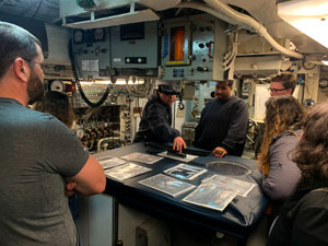 Honors students inside the USS Razorback submarine.