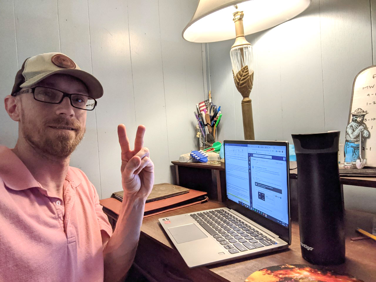 Cory Morris sitting at desk in his home during pandemic taking online class over the pandemic
