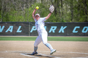 Pitcher Brooke Nalley winding up to pitch the ball.