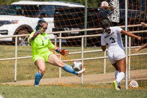 Brooklyn Mize keeping the soccer ball out of the goal.