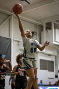 India Atkins going up for a basket against defense.