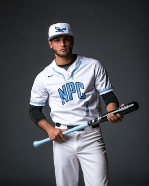 Panama Mendez in baseball uniform with bat
