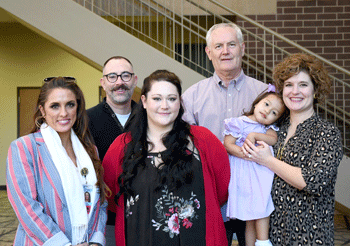 Pictured left to right are Erin Oseguera, Kristof Waltermire, Brittany Moore, Peter van den Huevel, Vivienne Rose Iverson, and Frances Elizabeth Iverson. 