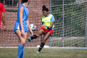 Deitie Hale kicks soccer ball.