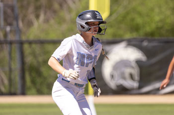 Jadyn Hart about to steal a base during a game.