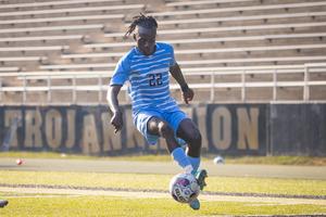 Pualo Ndenzako dribbling the soccer ball with foot.