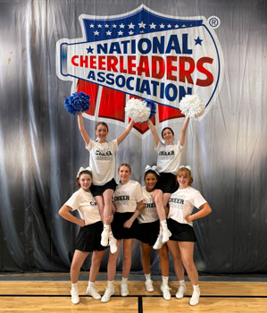 Cheerleaders in a pyramid.