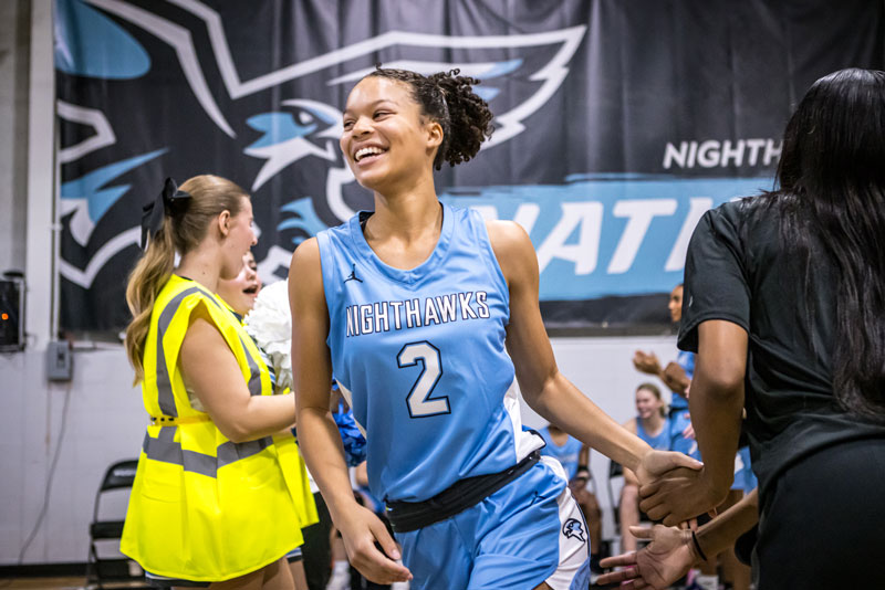 Khyra Garrett smiling while entering the court. 