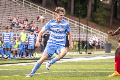 NPC soccer player, Jack Avery, going after the ball.