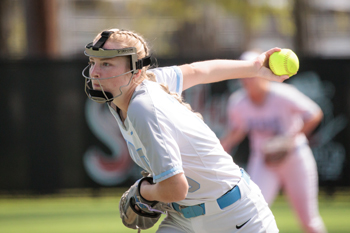 On the mound, Jadyn Hart prepares to release a pitch.