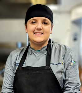Julia Marshall in chef cap and apron.