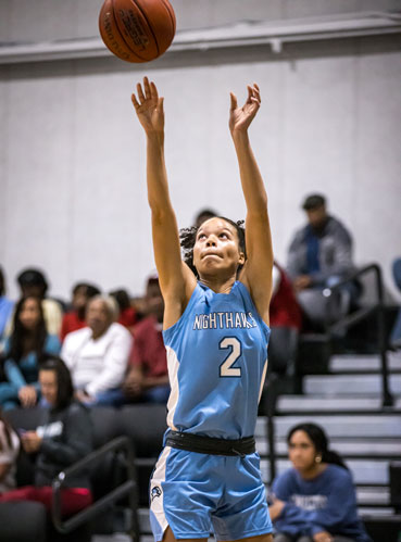 Kyrah Garrett shoots the basketball.