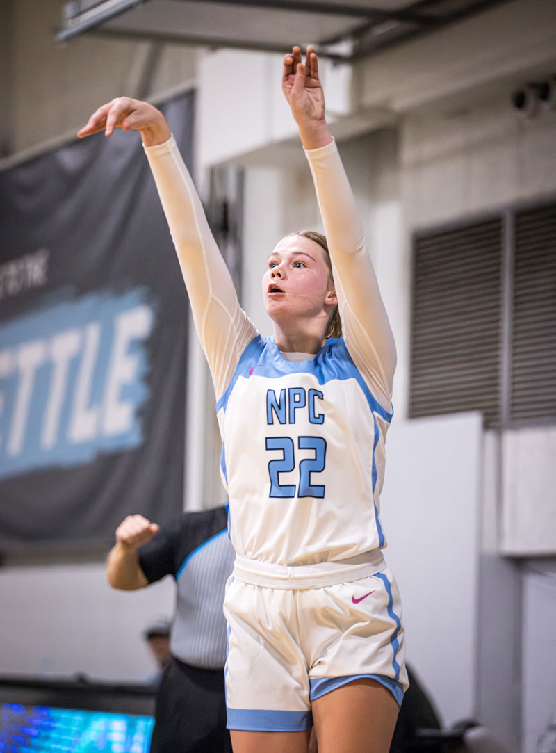 Hannah McLain after shooting the ball, hands in the air.