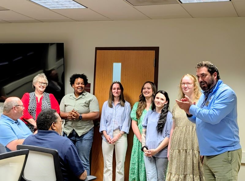 Pictured right to left: Dr. Chuck Argo, Katrina Bryant, Brook Reed,  Kassidy Gardner, Brooke Wyatt, Brittney Henry, and Leann Hardin. Seated: Board of Trustee members Raymond Wright and Jim Hale .
