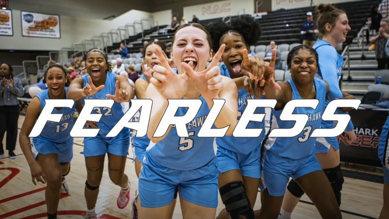 Women's basketball group picture with the word fearless.