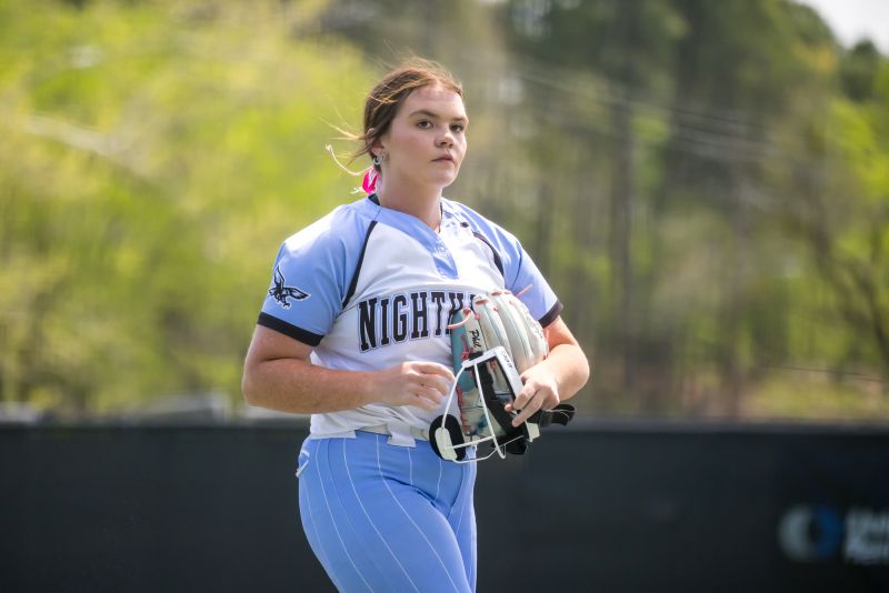 Bailee Cowell in her Nighthawk softball uniform on the field.
