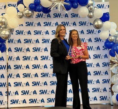 Heidi Balliette receoving an award.