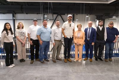 Arismel Nestor, a student from Hot Springs World Class High School enrolled in Career Academy Welding Program, Jeff's daughter (not sure name), Jeff, Josh Krauss, owner of FiberPro, Jonathan Foster, Xpress Boats CFO, Rory Herndon, Xpress Boats CEO, McMahon, Bill, welding student John Hall, welding student Nick Ellis.