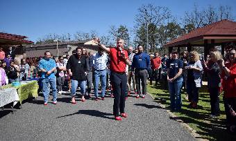 Dean Hudnell leads the men's march for International Women's Day