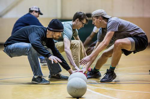 NPC students and faulty lining up with dodgeballs